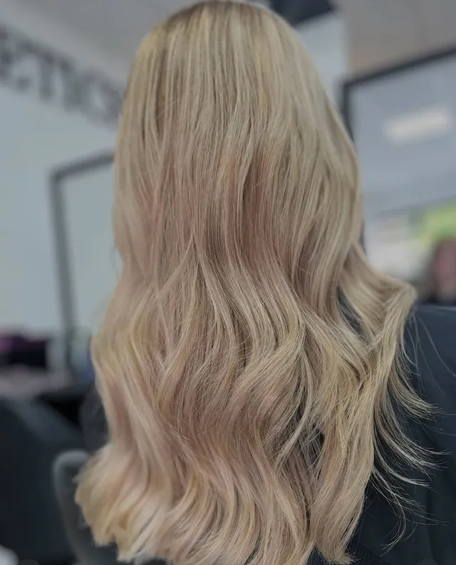 A soft, dimensional blonde balayage by Holly
